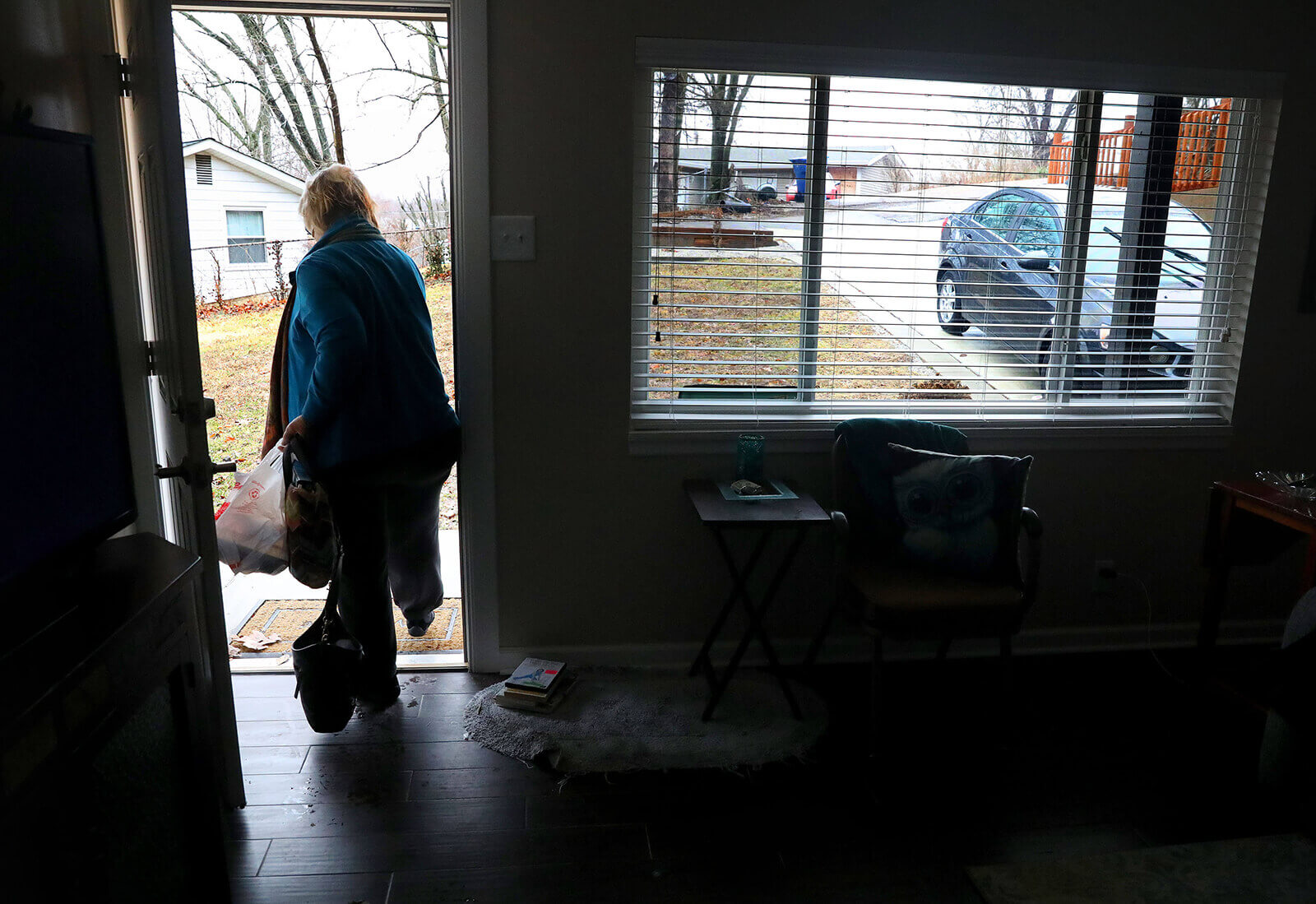 Lonni Schicker leaves the Fenton apartment she shares with her son on Friday, Feb. 23, 2018, to drive to the Ballwin office of Guide Book Publishing. She usually works from home but goes to the office occasionally to check in with her boss.