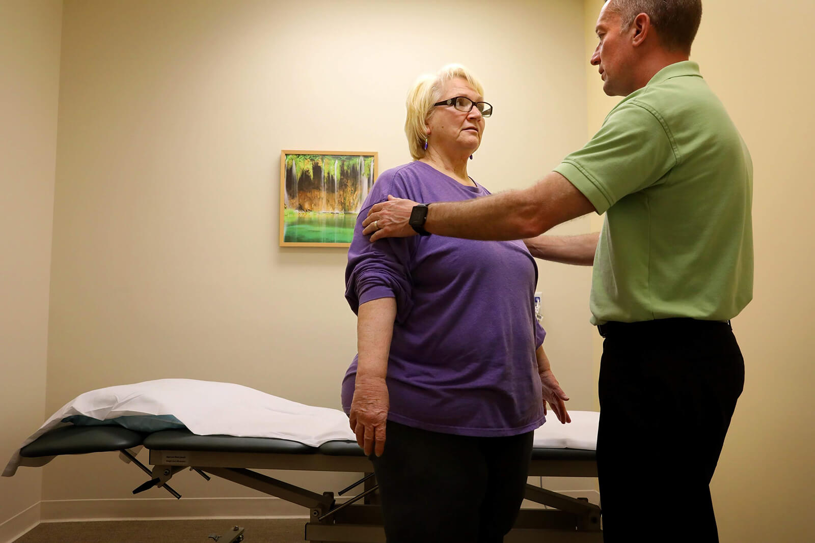 Physical therapist Derek Gould prepares Lonni Schicker for an exercise during her first physical therapy appointment on Wednesday, April 25, 2018. Lonni has been falling frequently and the physical therapy is to improve her motor skills.