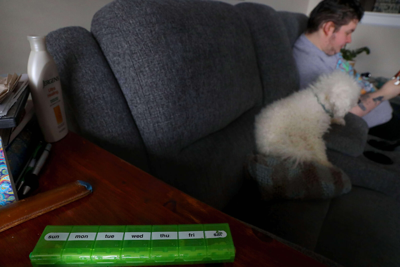 Lonni Schicker keeps her medication box, photographed on Friday, Feb 23, 2018, close to where she spends a lot of time, near the living room couch where Dan Schicker and Harry also often hang out.