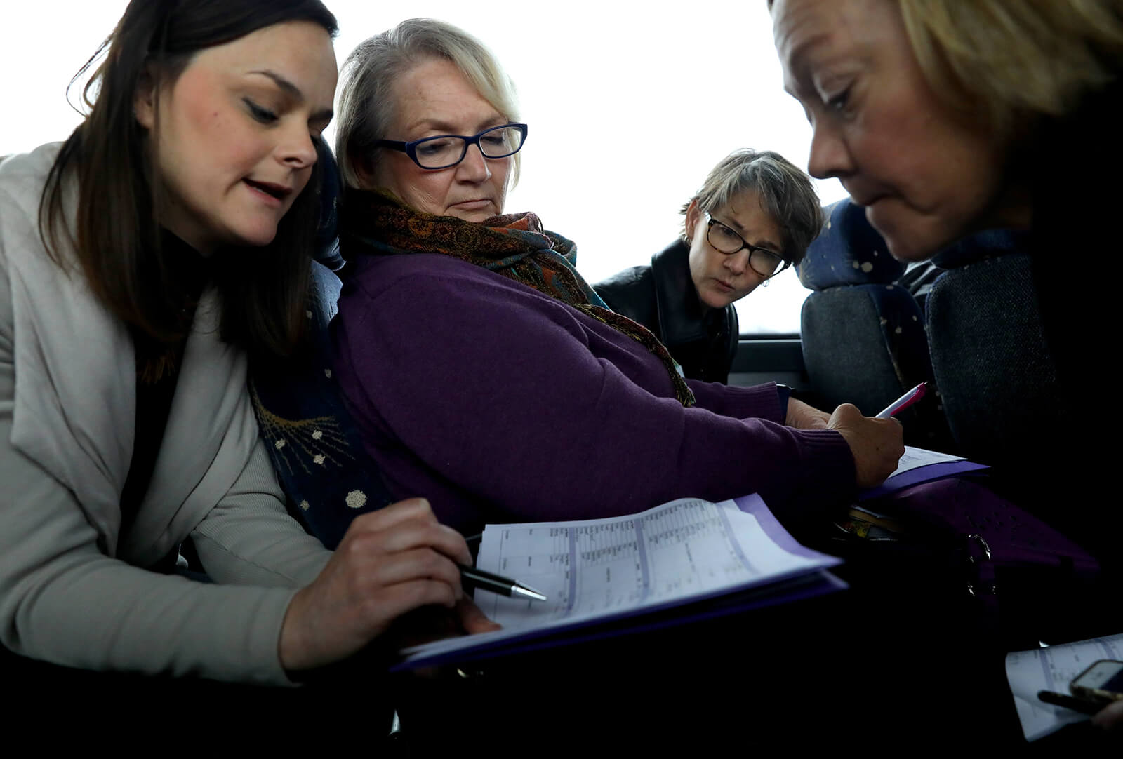 Lonni Schicker (center), goes over the logistics of a trip to the Missouri Capitol on March 7, 2018, with Eva Tucker (left), and Peggy Killian, vice president of communications, and Carroll Rodriguez, senior vice president of public policy, for the Greater Missouri Chapter of the Alzheimer's Association. Advocates lobbied Missouri legislators and had a rally in the Capitol to draw attention to their cause.